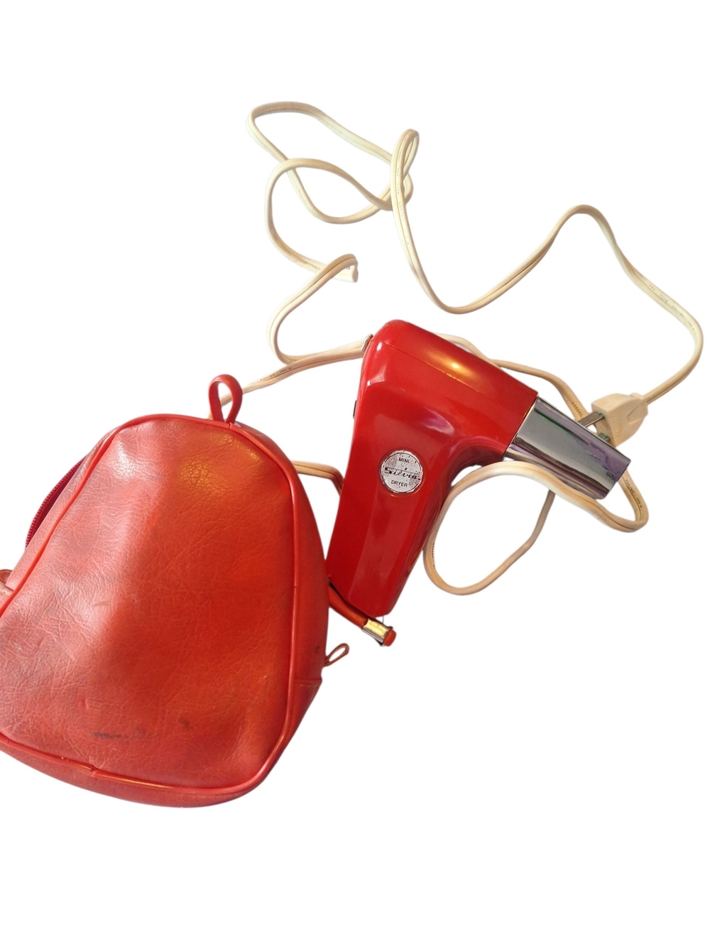 Vintage red Mini Silvia travel hair dryer from the 1960s or 1970s